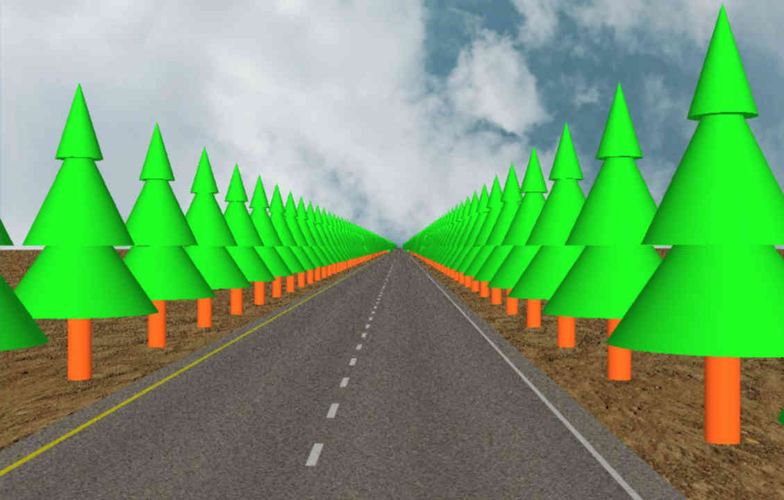 Carretera muy larga con árboles a los lados.